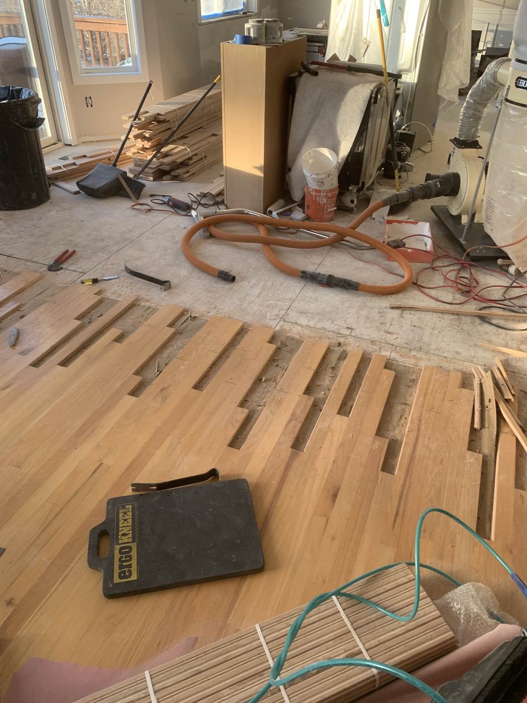 New boards woven into the old floor before sanding.