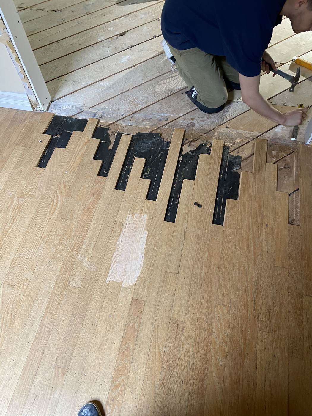 Damaged boards cut out and replaced in a staggered pattern.